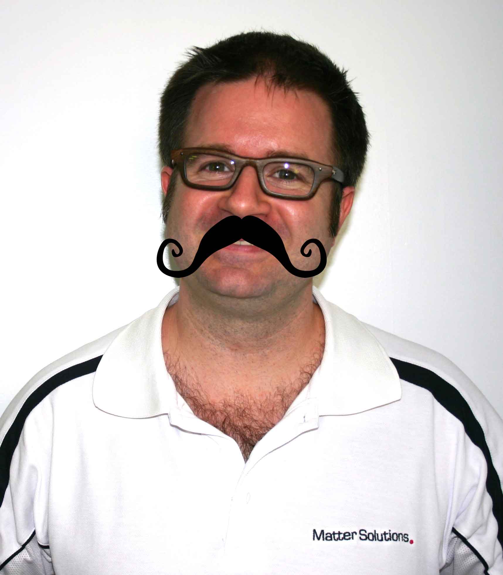 Matter Solutions team member with a Movember moustache graphic overlay, wearing branded polo shirt