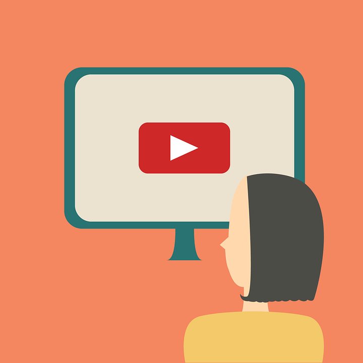 Flat illustration of a person watching a YouTube video on a desktop monitor