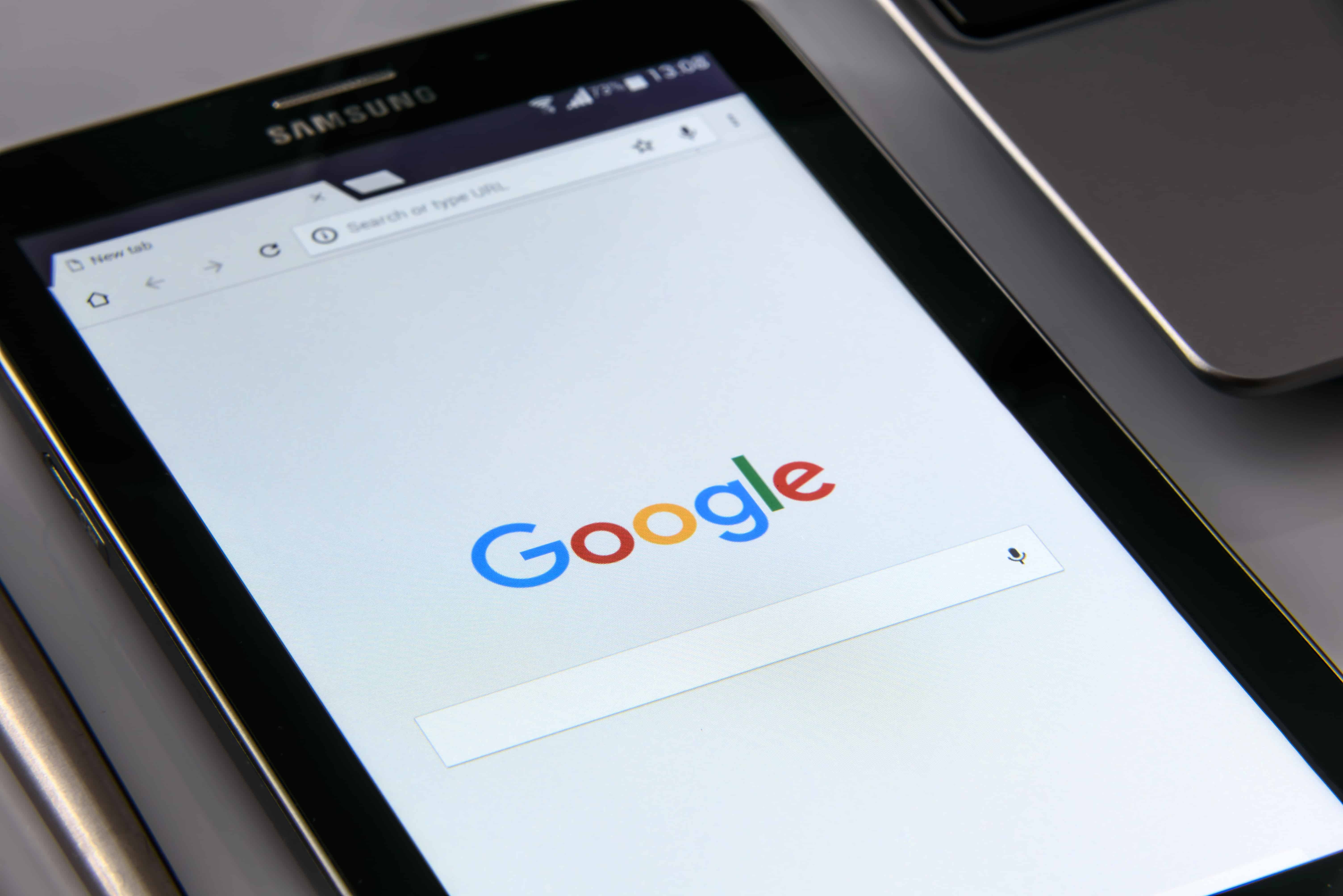 Samsung tablet displaying the Google homepage with search bar, used to illustrate Google My Business optimisation